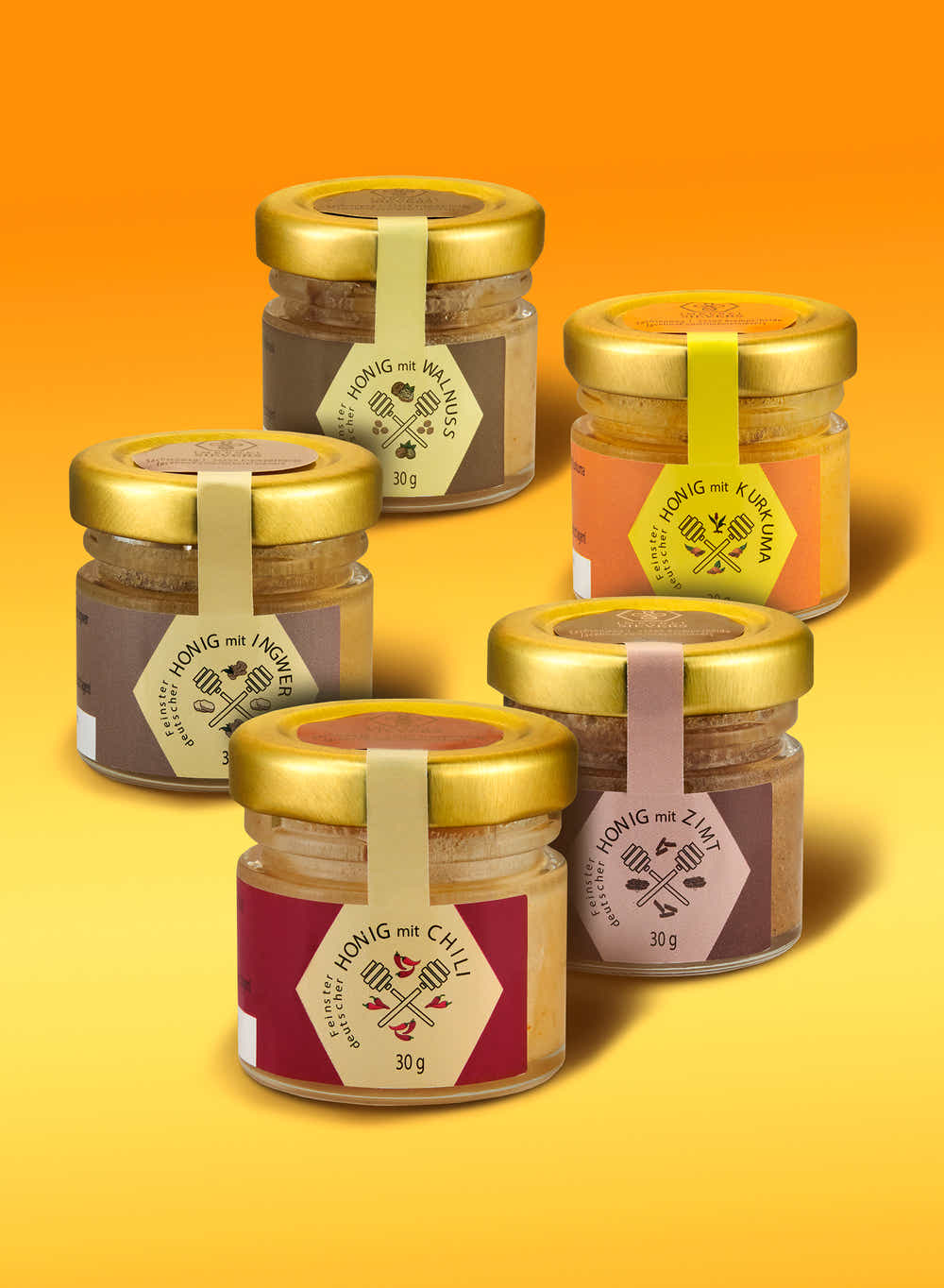 5 Gläschen je 30g in den Sorten Honig mit Chili, Ingwer, Kurkuma, Walnuss und Zimt machen das Honig-Set "Gewuerzgold" aus